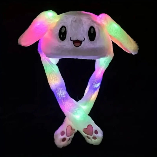 Plush toy with glowing multicolor LED lights on a black background